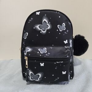 NWT - Mini Backpack in Black with White Butterfly Print, Zipper Closure.